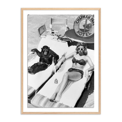Woman Sunbathing With Chimpanzee	By Getty Images by Four Hands