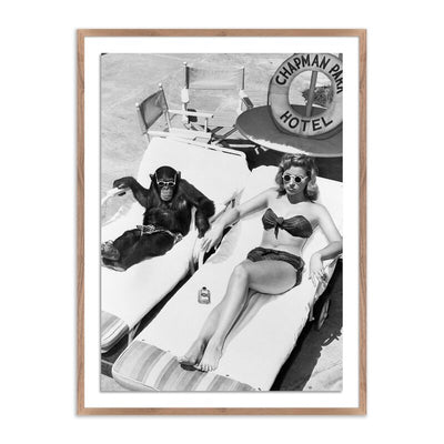 Woman Sunbathing With Chimpanzee	By Getty Images by Four Hands
