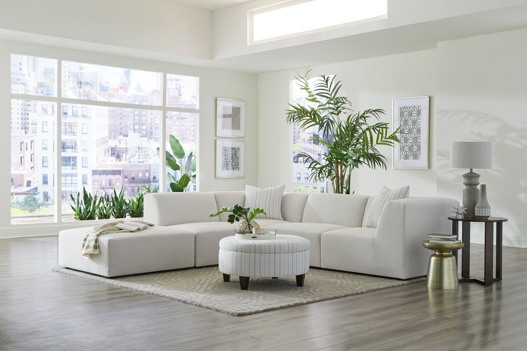 FINSBURY sectional in a bright apartment with a city skyline view