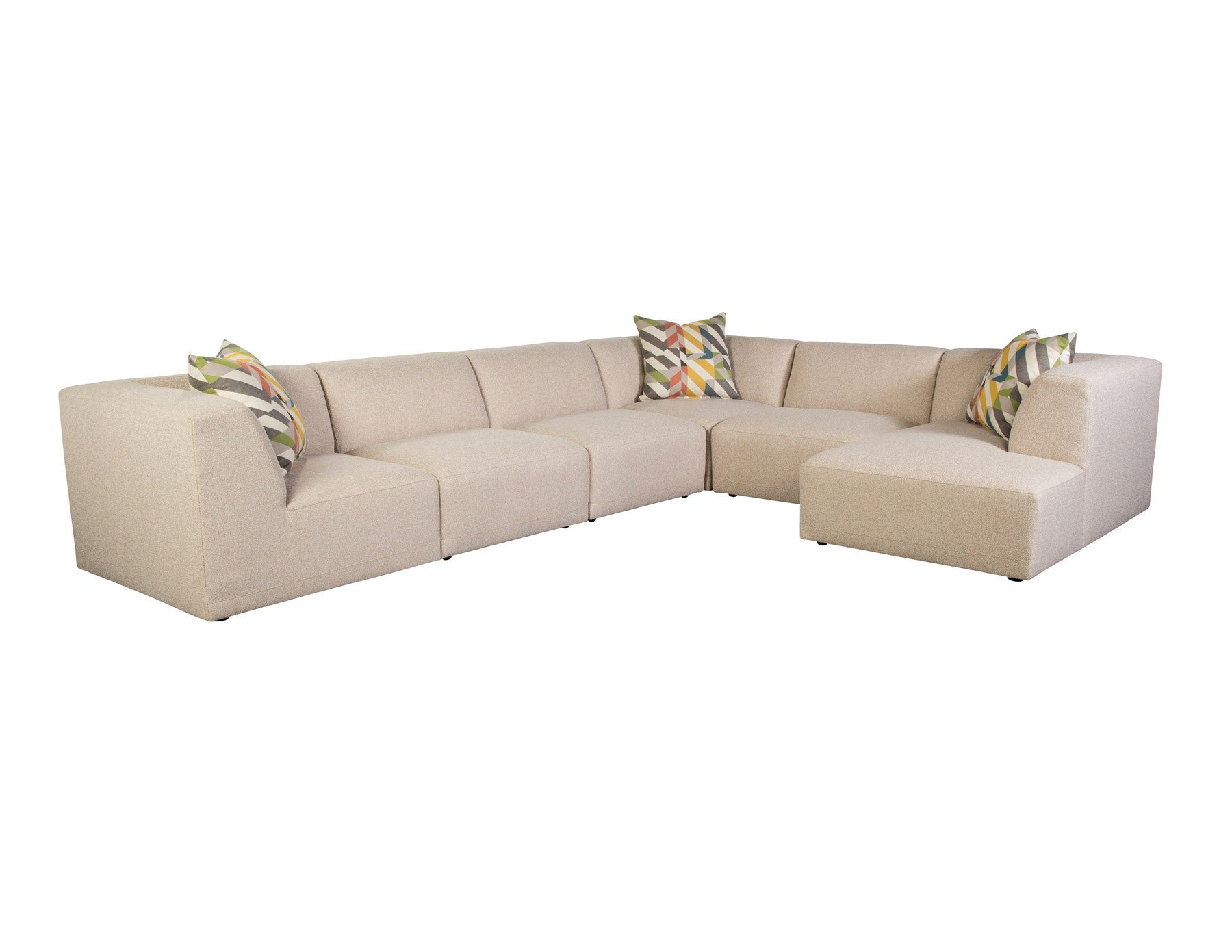 FINSBURY sectional in an oatmeal fabric with patterned pillows